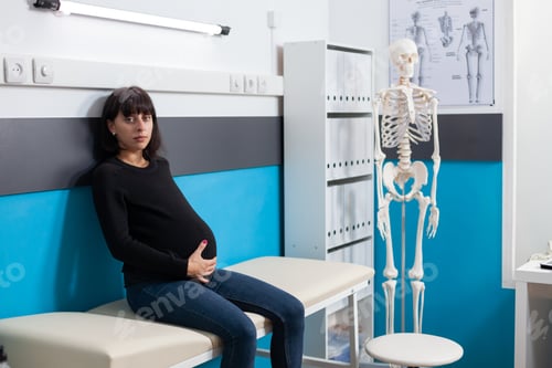 Preview: Portrait of pregnant woman waiting on physician to do consultation