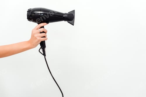 Vista previa: Hairdryer in hand. Isolated on white background