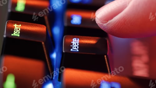 Preview: Man finger hovers over the Delete key for a few seconds before deciding to press it.