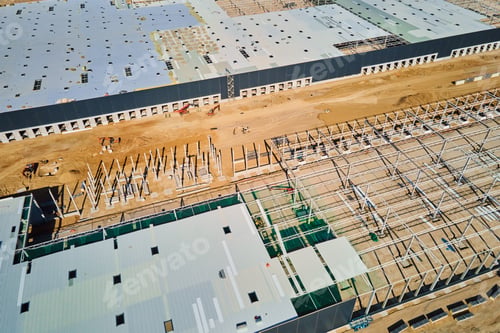 Preview: Construction site with steel frame structure of warehouse building, aerial view