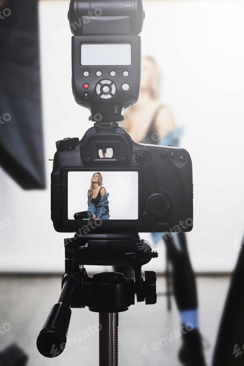 Preview: DSLR Camera Capturing a Female Model in a Studio