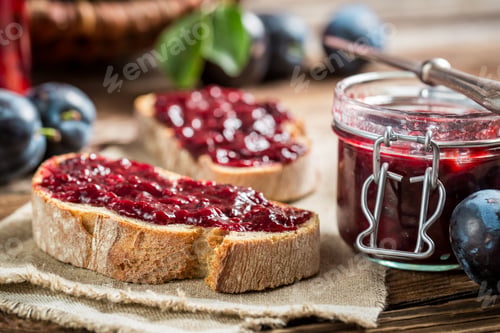 Preview: Closeup of sandwich with fresh plum jam