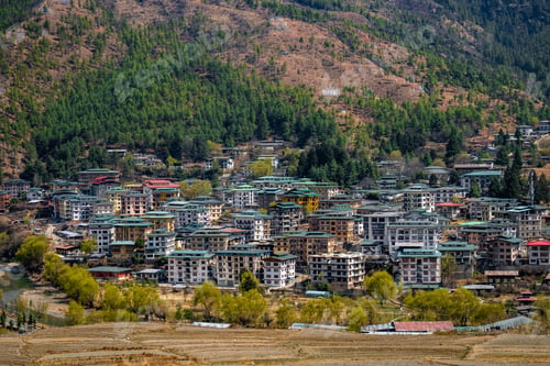 Preview: Scenic view of Thimphu city in Bhutan, surrounded by green hills