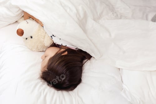 Preview: Cute little child girl sleeping with teddy bear