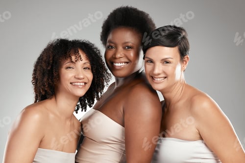 Preview: Shot of a diverse group of women standing close together in the studio and posing