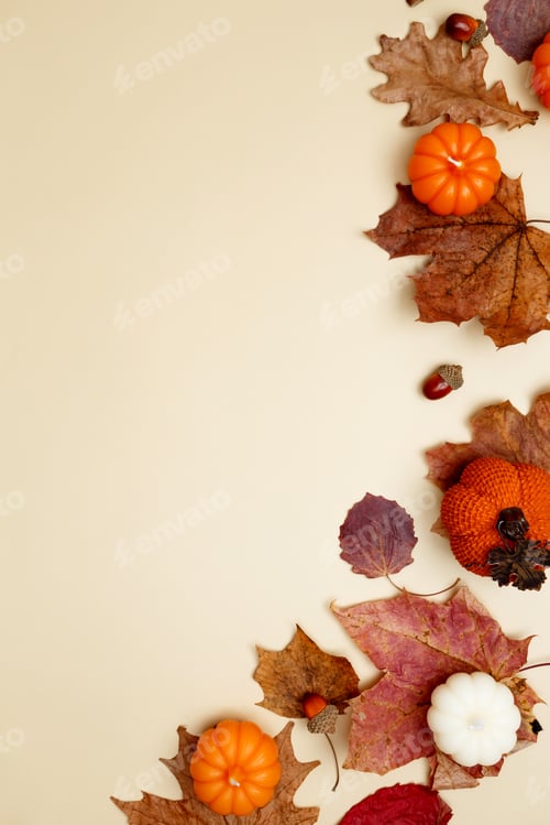 Preview: Autumn composition with maple leaves, decorative pumpkins and candles. Top view. Copy space