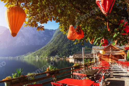 Preview: Summer cafe on the beautiful lake between mountains. Alps. Halls
