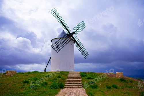 Preview: Closeup shot of a windmill in the natural landscape under a cloudy sky