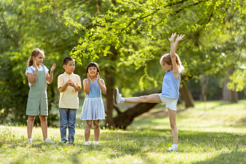 Preview: Group of asian and caucasian kids having fun in the park