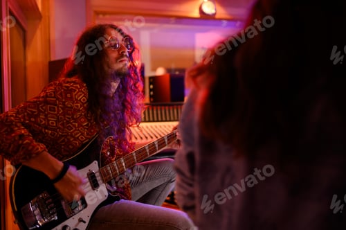 Preview: Bass player fully immersed in jamming.