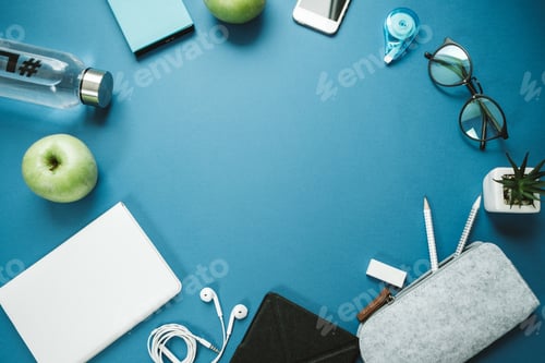 Preview: Space for Text healthy person Desktop: pencils, water, apple, phone, glasses
