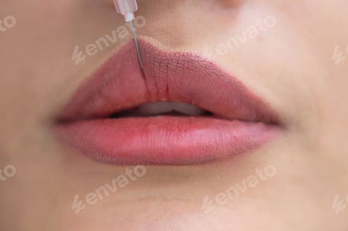 Preview: A thoughtful Grecian esthetician gazes into a mirror, her curly hair framing her face. Holding a