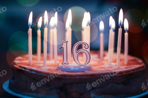 Preview: Homemade birthday apple pie cake with sixteen burning candles and figures 16 on top