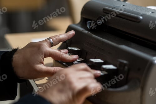 Preview: Blind person with a braille machine, Disability concept