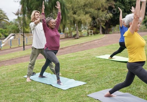 Preview: Happy multiracial people doing yoga exercise at park - Healthy lifestyle concept