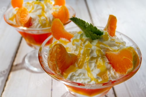 Preview: Closeup of a dessert with mandarins and jelly
