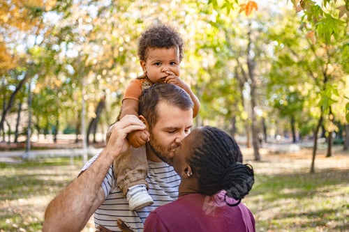 Preview: Family bonding under the autumn sun in a vibrant park