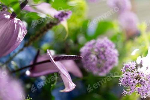 Preview: Purple calla lilies and delicate flowers