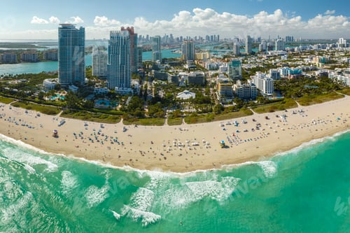 Preview: Miami Beach city with high luxury hotels and condos and sandy beachfront.