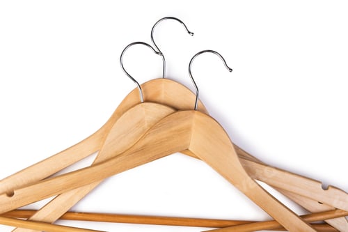 Preview: Close-up of Wooden Clothes Hangers on White Backdrop