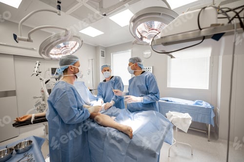 Preview: Surgeons in Sterile Operating Room Performing Surgery