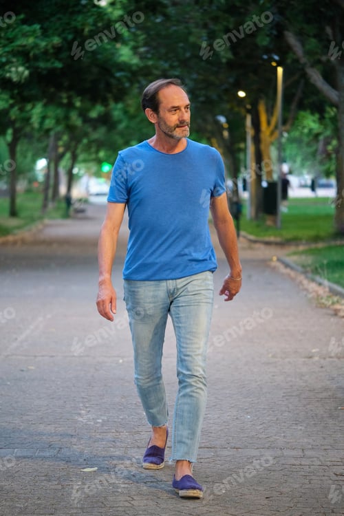 Preview: Full-length outdoor portrait of mature adult man.