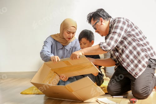 Preview: Family Bonding And Parenting, Father And Mother Preparing Cardboard Box Airplane For Playing Flight