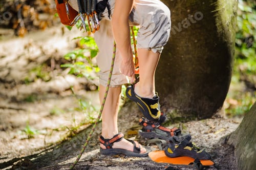 Preview: Climber putting climbing shoes on - close up