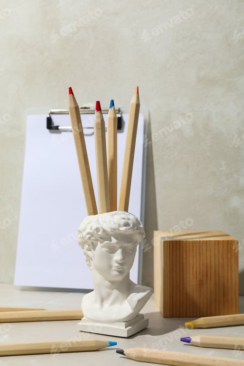Preview: Drawing concept with ancient head on light table