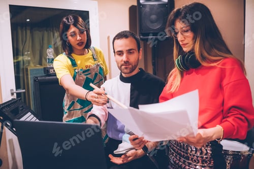 Preview: Three young adult learning lyrics in studio