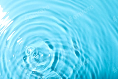 Preview: Closeup view of water with rippled surface on light blue background