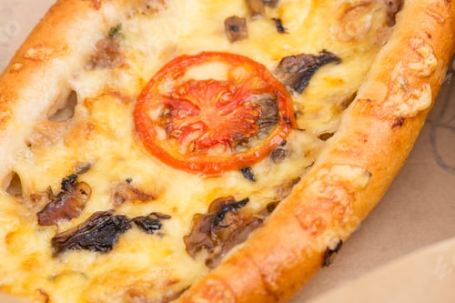 Preview: Slice of delicious american pizza with mushrooms.