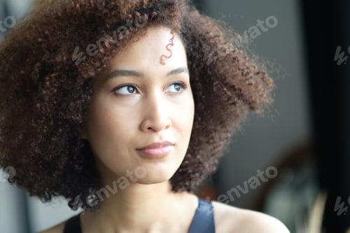 Preview: Close up portrait of cute stylish African American woman with beautiful face. Elegant fashion model.