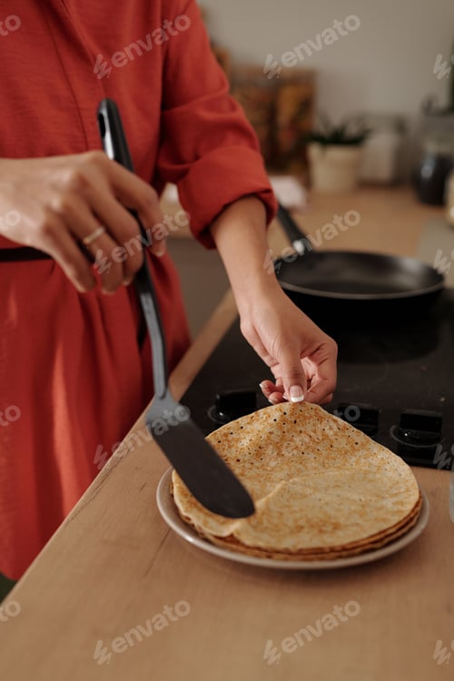 Preview: Preparing Crepes on Kitchen Counter with Frying Pan