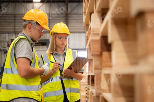 Preview: Both of workers work in a woodworking factory, Checking inventory the wood in the wooden warehouse