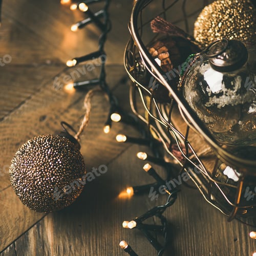 Preview: Christmas tree toy decoration balls and light garland, wooden background