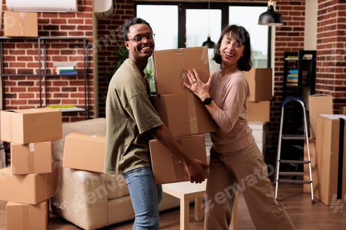 Preview: Portrait of diverse husband and wife moving together in rented apartment