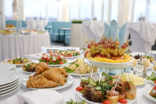 Preview: Delicious buffet spread featuring various appetizers, pastries, and fresh fruits set