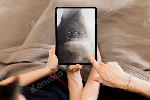 Preview: Couple using a tablet screen mockup together in bed