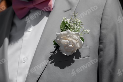 Preview: Groom in grey tuxido on Wedding day, closeup details at natural light