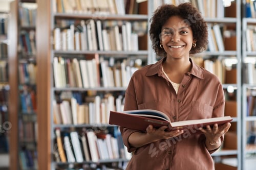 Preview: Student reading book in library