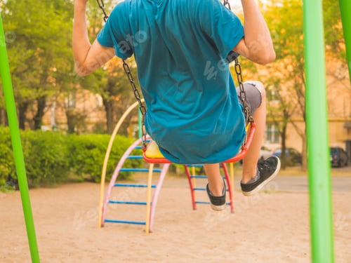 Preview: young person close up flying and swinging during summer season holidays happy concept
