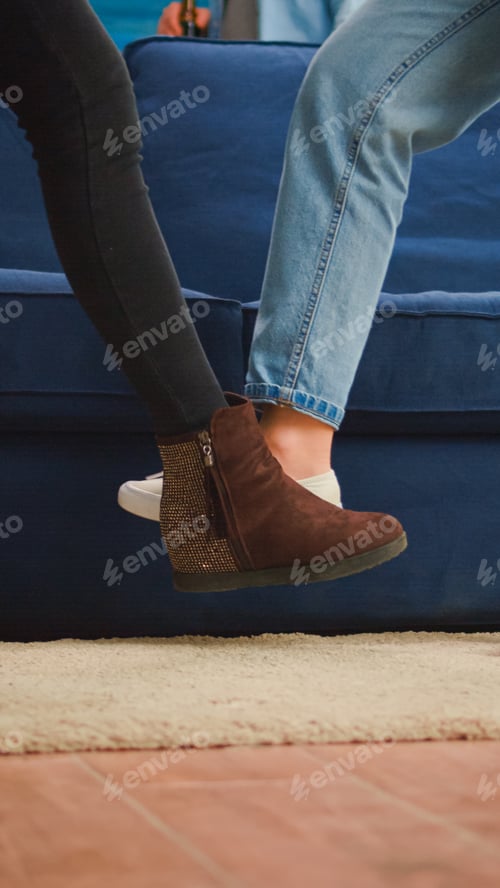Preview: Clouse up of friends touching feet keeping social distancing