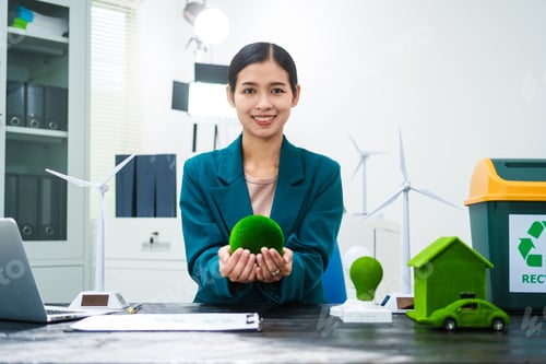 Preview: An Asian businesswoman sits at her desk, discussing clean energy solutions their impact on homes