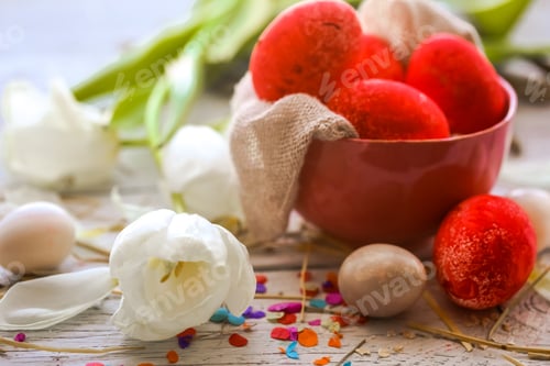 Preview: Easter still life with colored eggs in a plate and white tulips