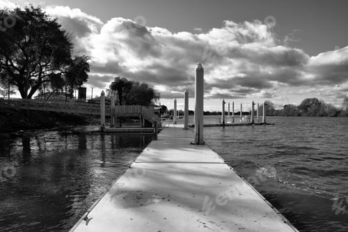 Preview: Serene dock under dramatic clouds