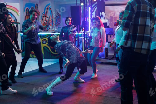 Preview: Friends watching woman dancing in club