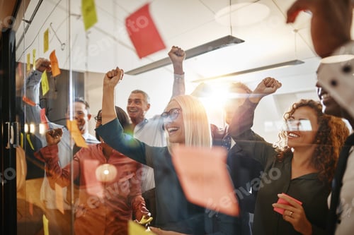 Preview: Cheering businesspeople brainstorming with sticky notes in an office