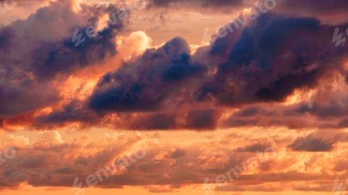 Preview: Orange Hues of Clouds at Sunrise or Sunset