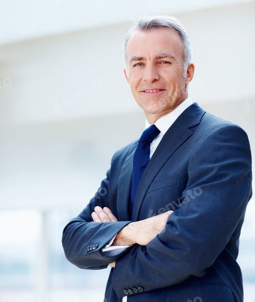 Preview: Successful businessman. Executive standing with arms folded.